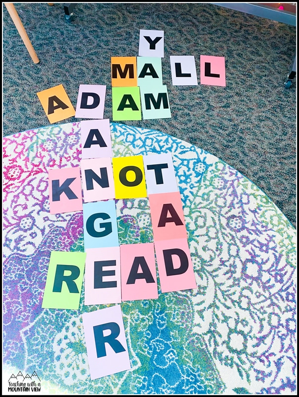  I give students a quick overview of how to play Scrabble, and then students work together to build their own Scrabble board using large letters. This is the station I monitor most closely so that they know how to play. 